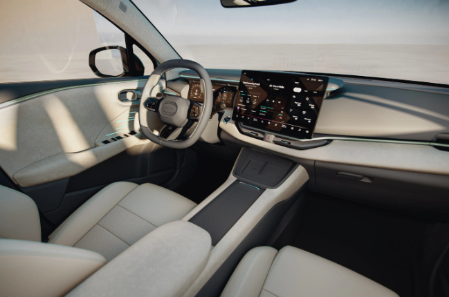 The interior of the car has a gray and white design with light green ambient lights. The interior of Lynk & Co’s new car is unique.