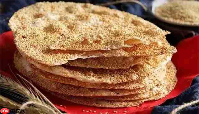 以下哪种非遗美食以‘薄如纸”而闻名