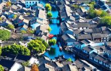 以下哪座古城曾是春秋越国都城被誉为一座没有围墙的博物馆