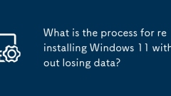 What is the process for reinstalling Windows 11 without losing data?