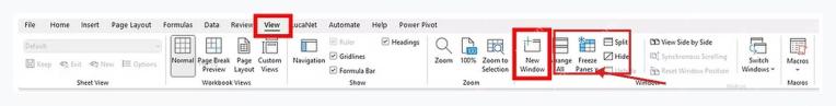 Excel 视图选项卡中的新建窗口按钮位置,用于打开第二个工作簿窗口