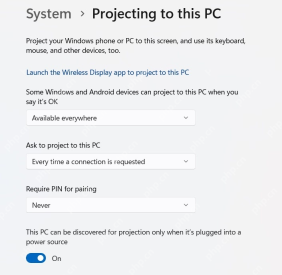 Windows 11 Projecting to this PC 页面显示 Launch the Wireless Display app 和配对选项